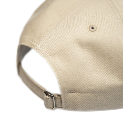 beige cap with brown embroidery