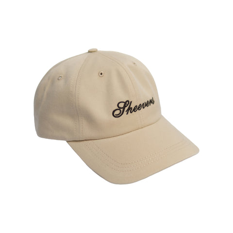 beige cap with brown embroidery