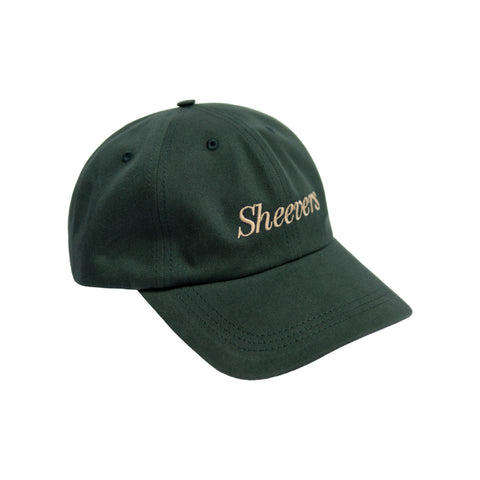 green cap with beige embroidery